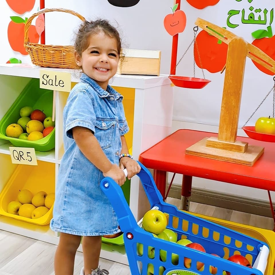 Happy child at play market — role play learning
